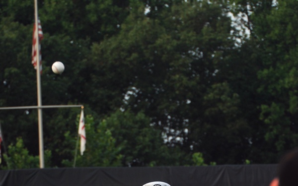 Capt. Rick Bodziak throws a ceremonial first pitch at Prince Georges Stadium