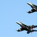 Super Hornets fly over USS George H.W. Bush