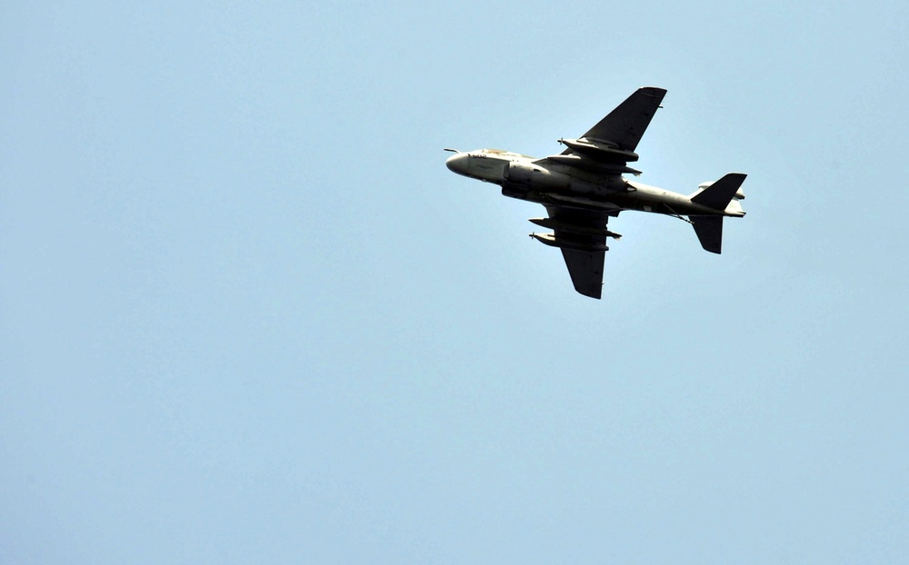 EA-6B Prowler flies over USS George H.W. Bush