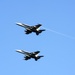 F/A-18C Hornets fly over USS George H.W. Bush