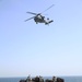 Marines move supplies during replenishment at sea
