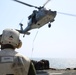 Marines move supplies during replenishment at sea