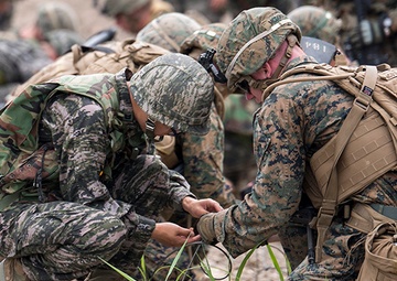 Exploding onto field, engineer Marines take range