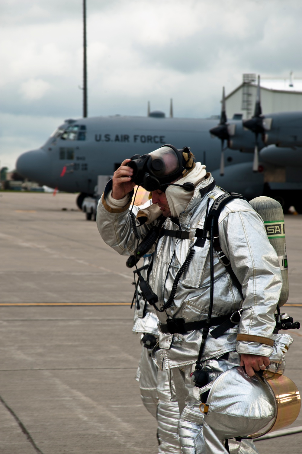 Capt. Nick Pressley removes breathing apparatus after exercise