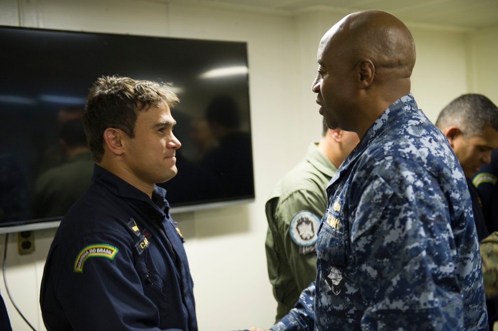 Brazilian naval officers and marines aboard USS America