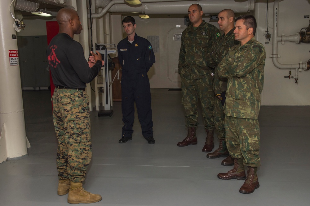 Brazilian naval officers and marines aboard USS America