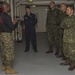 Brazilian naval officers and marines aboard USS America