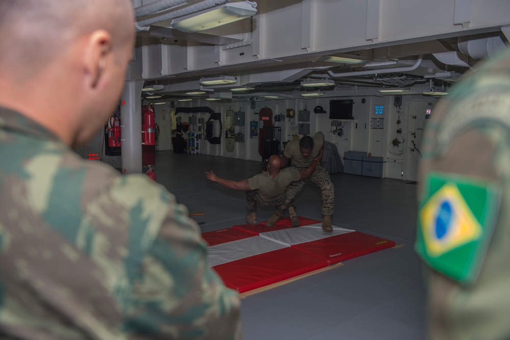 Brazilian naval officers and marines aboard USS America