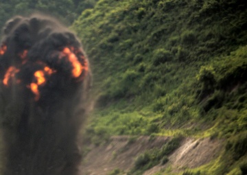 Exploding onto field, engineer Marines take range