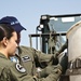Staff Sgt. Pat Englishby and Senior Airman Rochelle Densmore inspect a payload in preparation of a heavy drop