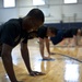 Civilian Marcus Anderson conducts physical training with fellow members of the U.S. Air Force's Delayed Entry Program