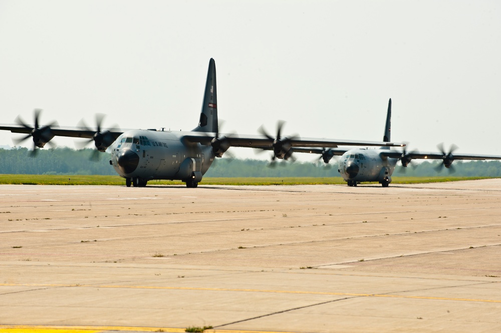 Two US Air Force C-130Js with the 815th &quot;Flying Jennies&quot; taxi toward the Niagara Falls ARS active runway for takeoff