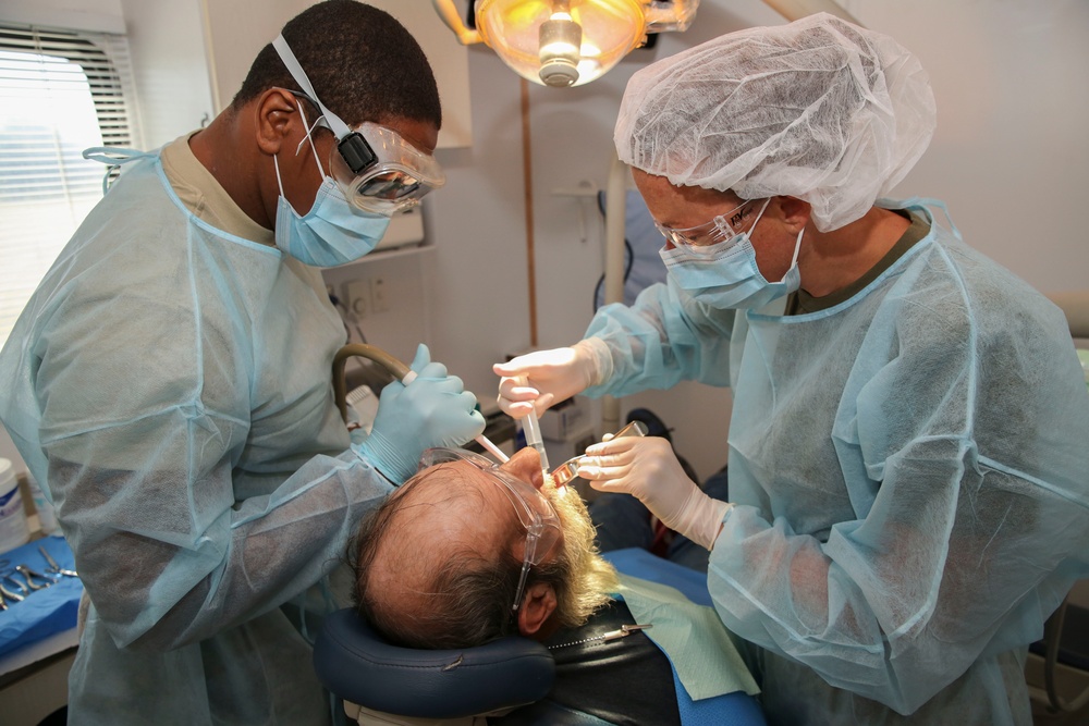Service Members Working Together Providing Healthcare to People in Need