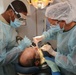 Service Members Working Together Providing Healthcare to People in Need
