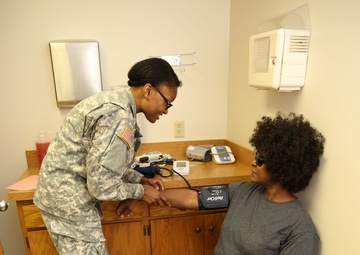 Service Members Working Together Providing Healthcare to People in Need