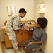 Service Members Working Together Providing Healthcare to People in Need