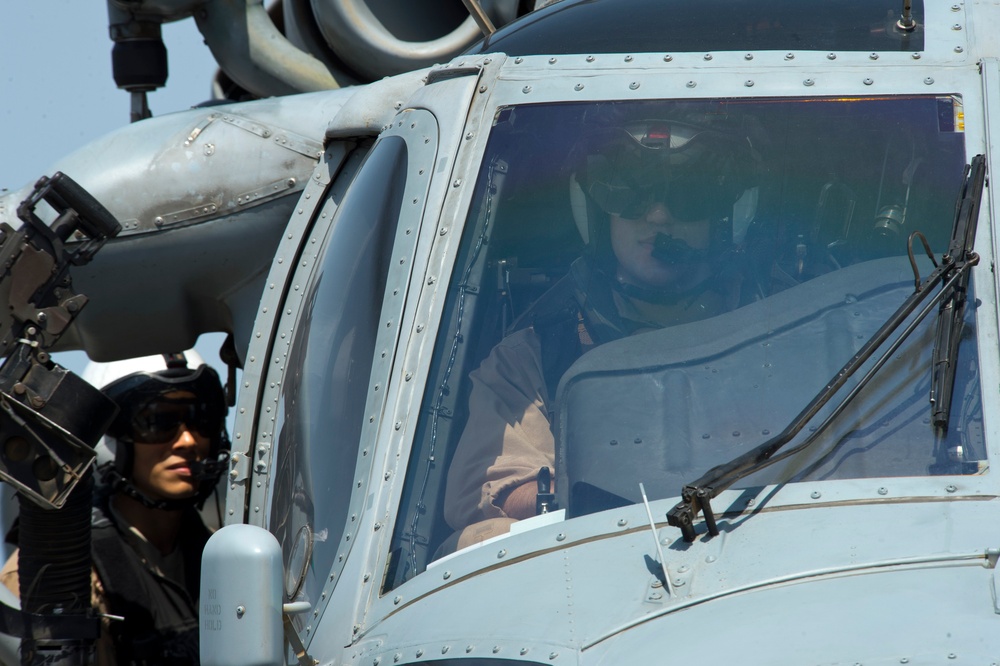 Seahawk crew prepares for takeoff aboard USS Arleigh Burke