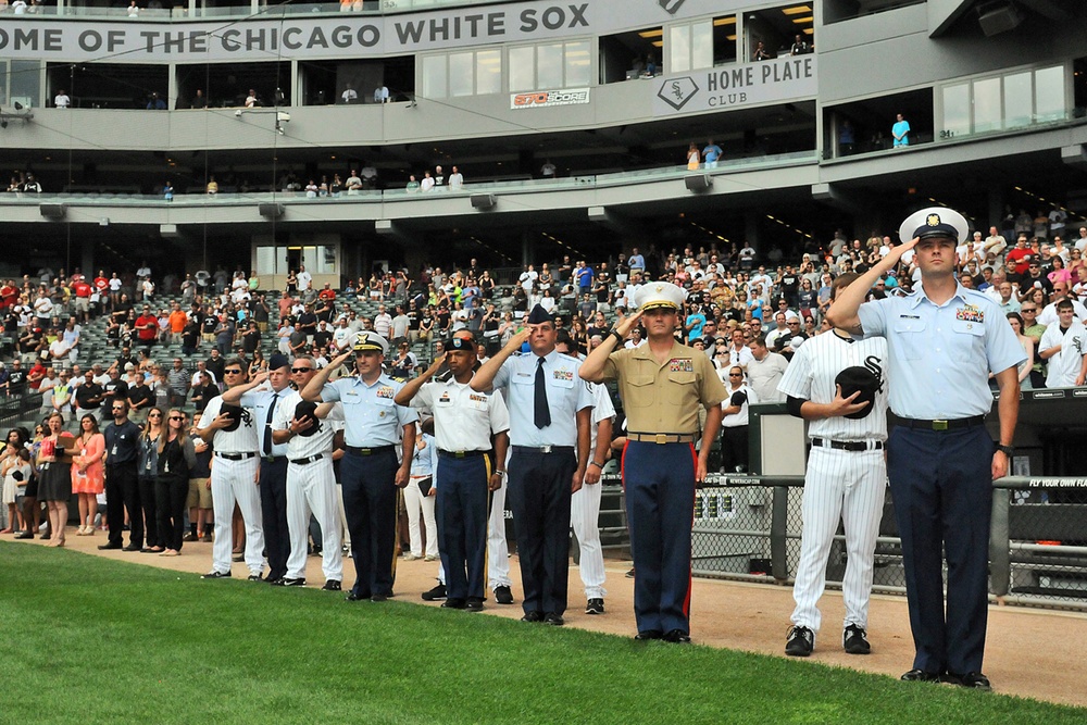 Chicago-based servicemen render a salute at Chicago White Sox home game