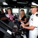 Kimball Gainor, Miss Seattle 2014, and Hailey Sturgill, Miss Seattle Outstanding Teen, are given a tour of the ship's bridge and helm by Lt. Zachary George