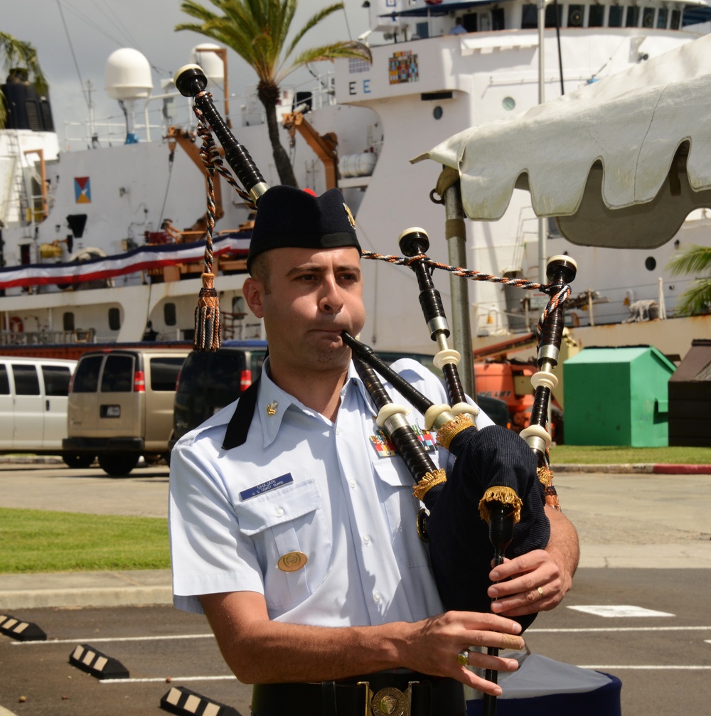 Coast Guard bagpiper performs during Honolulu ceremony