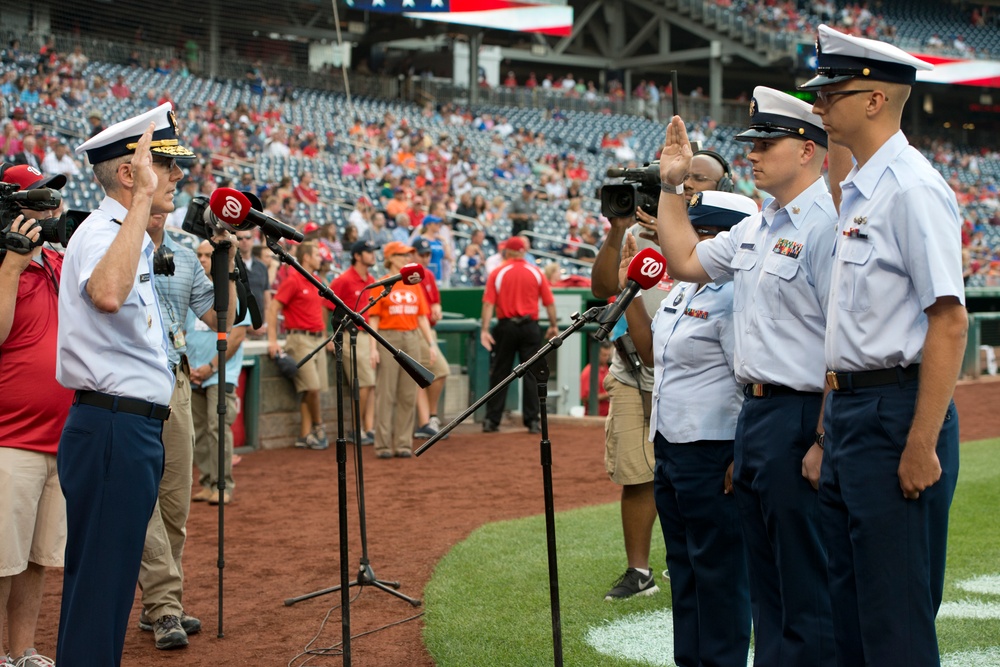 Vice Adm. Neffenger re-enlists three Coast Guardsmen at a Washington Nationals game