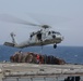 Sea Hawks transport supplies during replenishment at sea