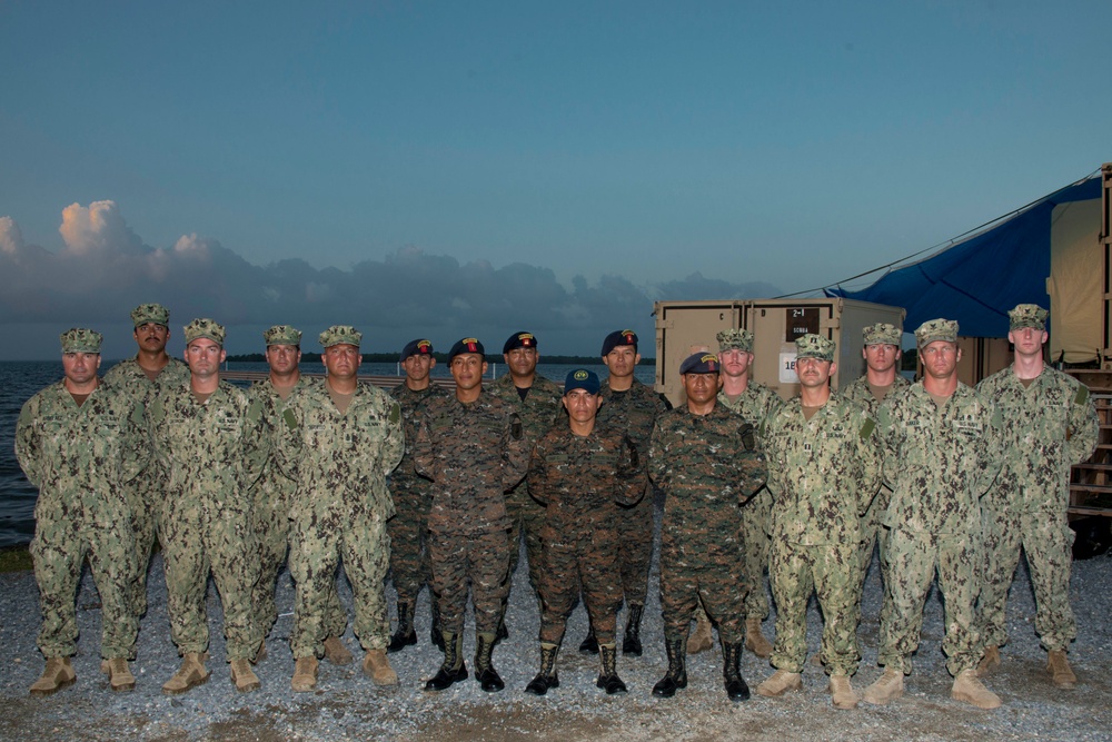 US Navy divers participate in a closing ceremony with Guatemalan divers as part of Southern Partnership Station '14