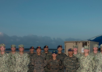 US Navy divers participate in a closing ceremony with Guatemalan divers as part of Southern Partnership Station '14