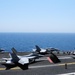F/A-18C Hornets prepare for takeoff during operations aboard USS George H.W. Bush in the Arabian Gulf