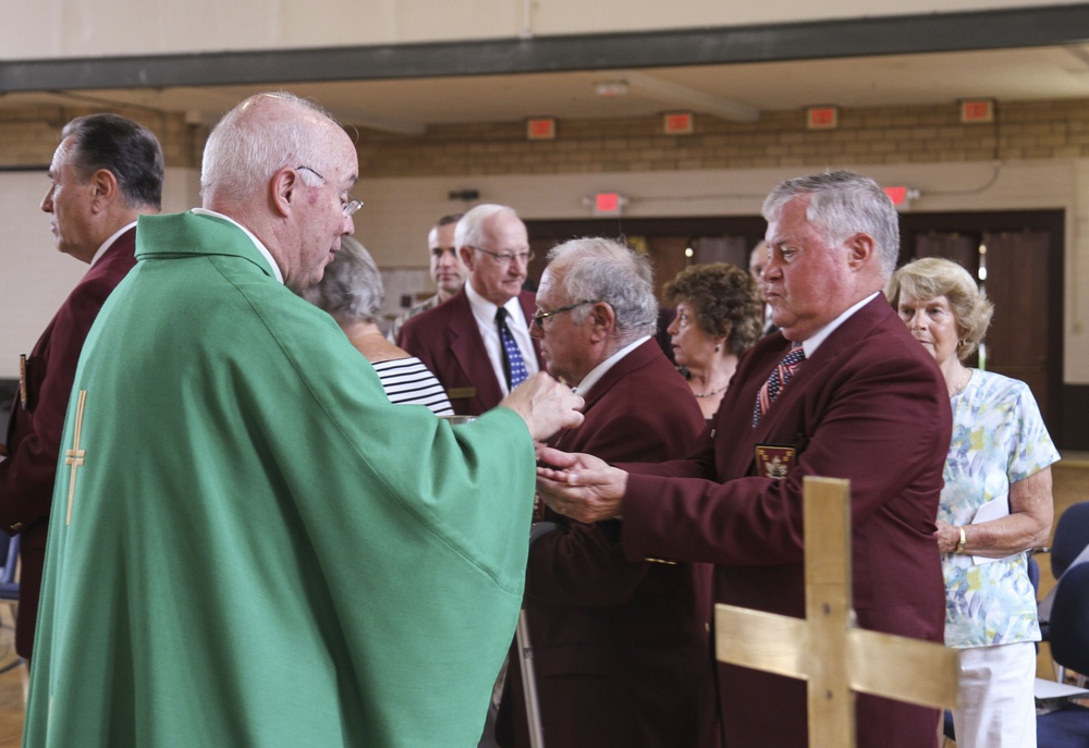 Chaplain Coyle gives Communion
