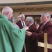 Chaplain Coyle gives Communion