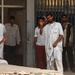 Iraqi shop owners wave to US Army Soldiers