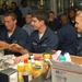 USS Carter Hall Sailors open holiday care packages