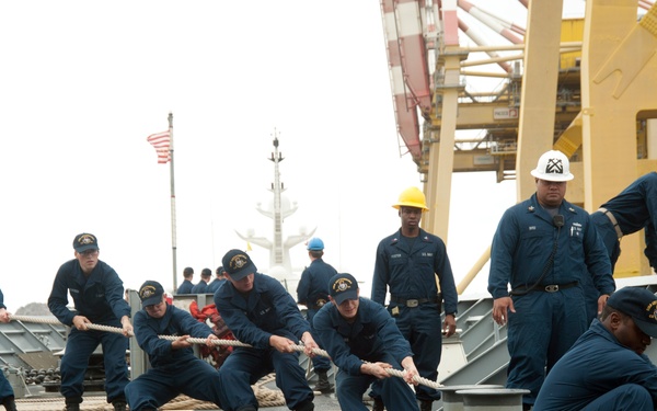 USS Gettysburg sailors secure a line while mooring the ship