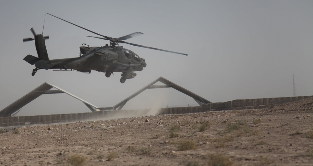 Apaches provide security for helicopters transporting Australian special operations soldiers