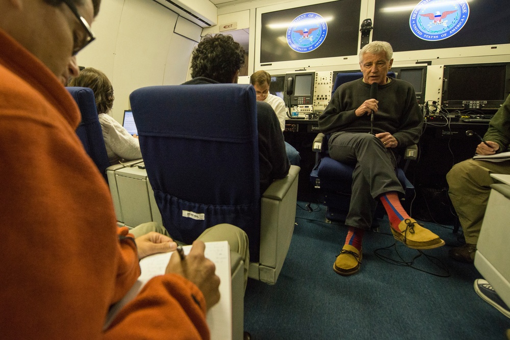 Hagel briefs reporters during flight to New Delhi