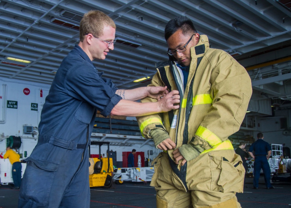 Midshipmen practice damage control aboard USS Peleliu