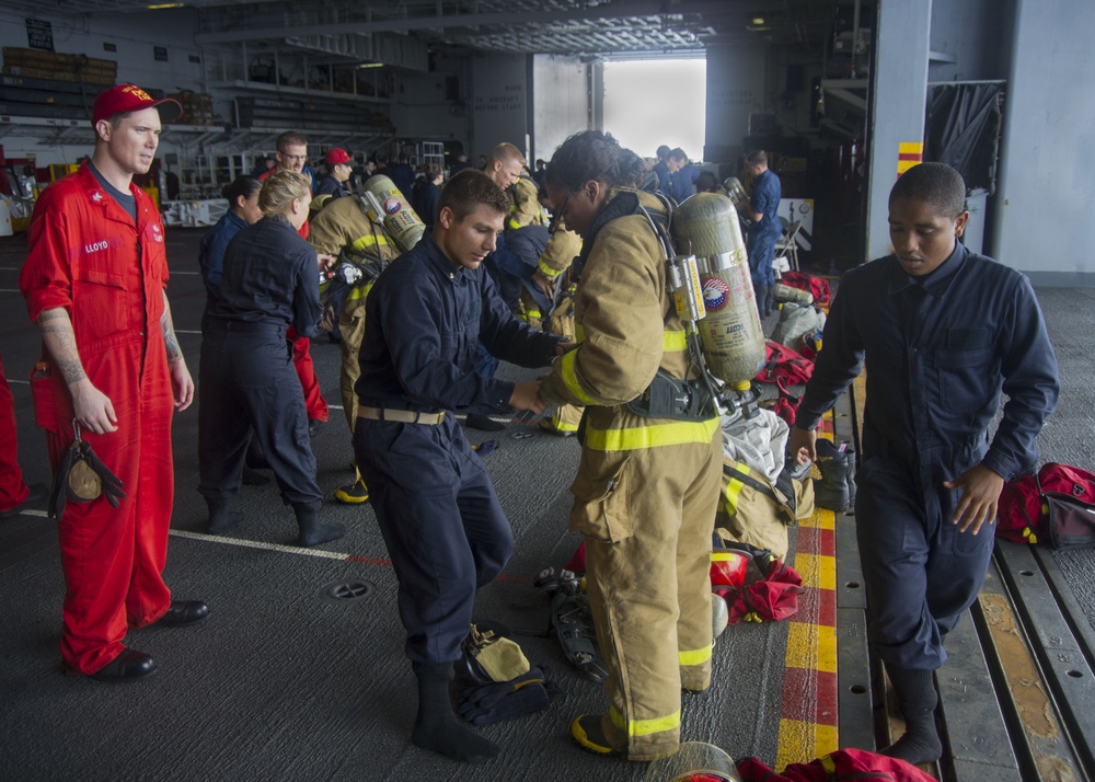 Midshipmen practice damage control aboard USS Peleliu