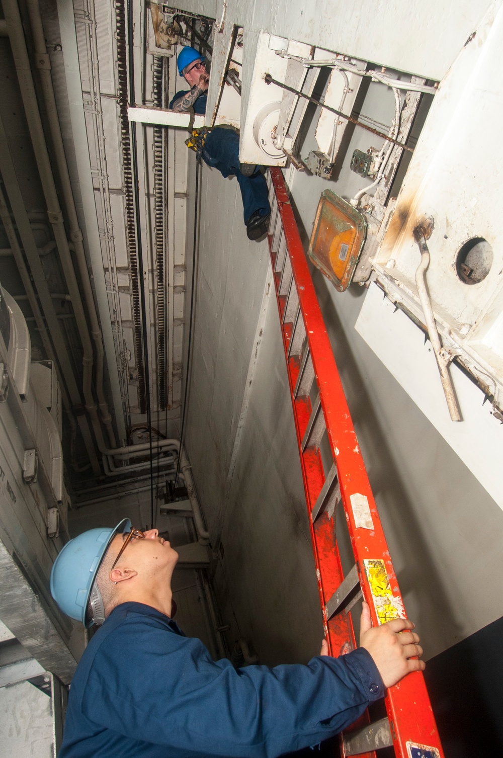 USS George Washington sailors at work