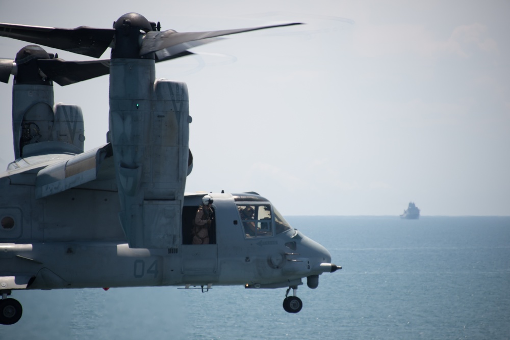 Osprey approach to USS Iwo Jima (LHD7), USS Fort McHenry (LSD43) in background