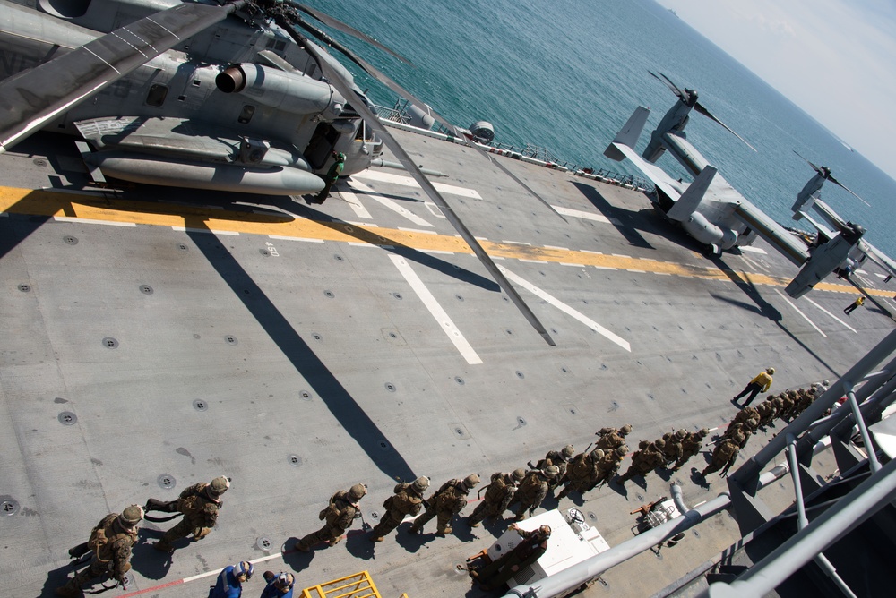 Marines prepare to debark USS Iwo Jima (LHD7)