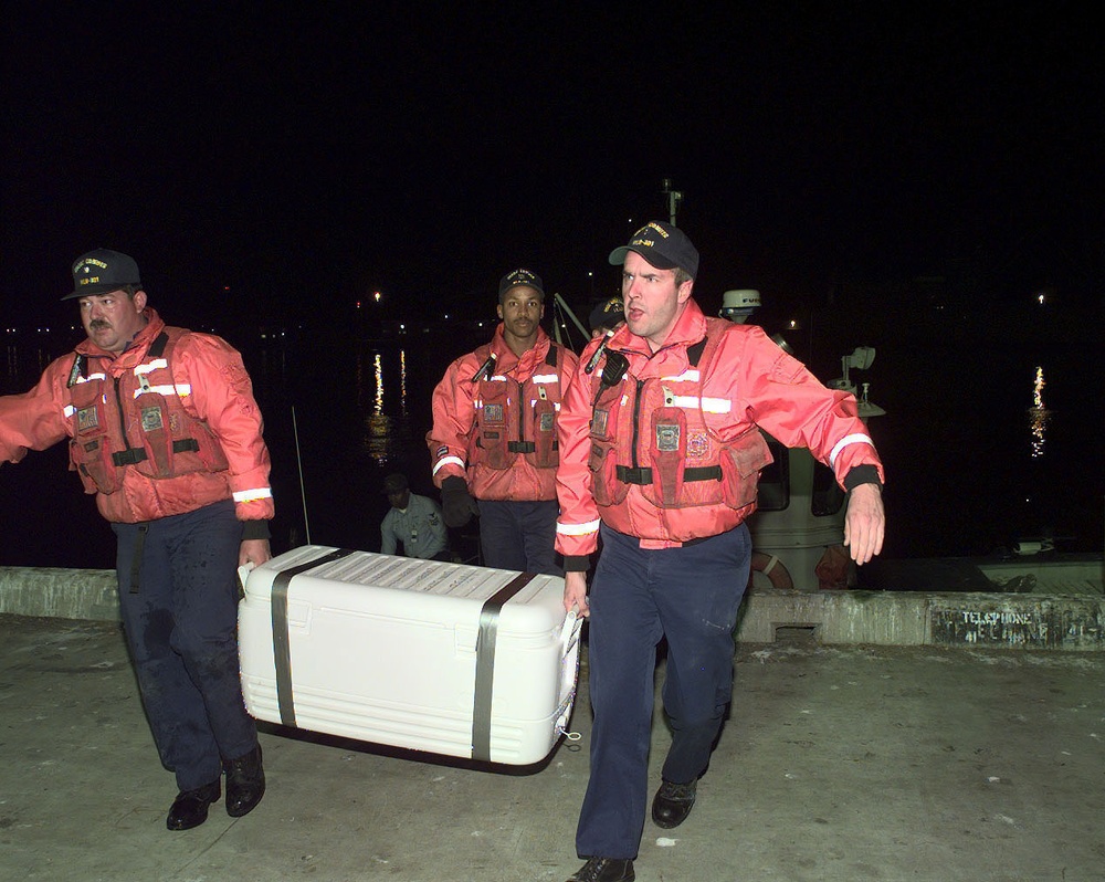 USCGS Conifer personnel deliver Alaska Air Flight 261 flight data recorders