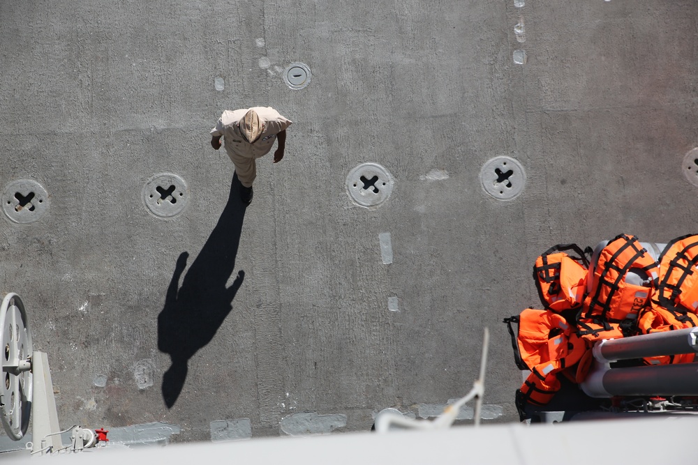 A Mexican navy Sailor crosses the deck of ARM Usumacinta during Partnership of the Americas 2014