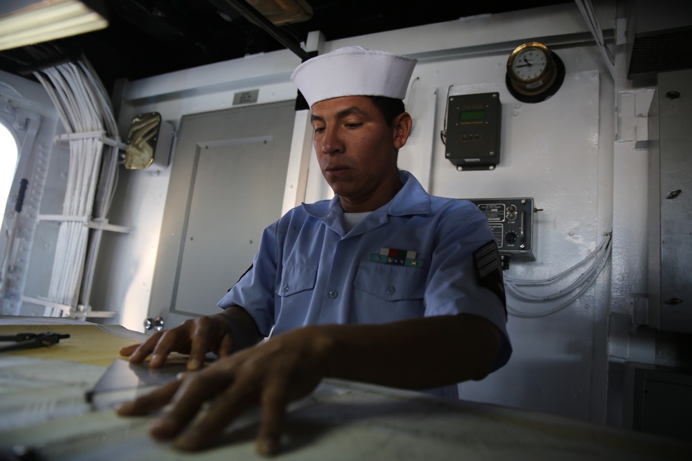 A Mexican navy sailor prepares navigational charts aboard ARM Usumacinta during a training evolution as part of Partnership of the Americas (POA) 2014