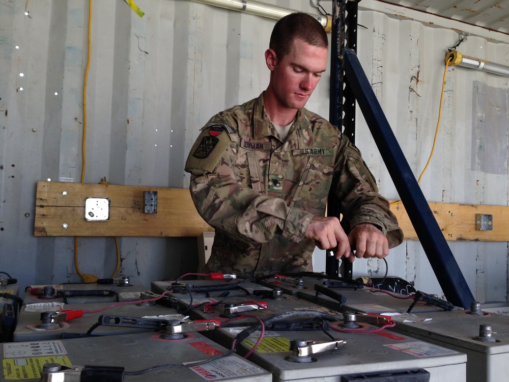 Soldier testing batteries