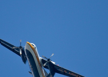 C-31A Troopship flies over AC