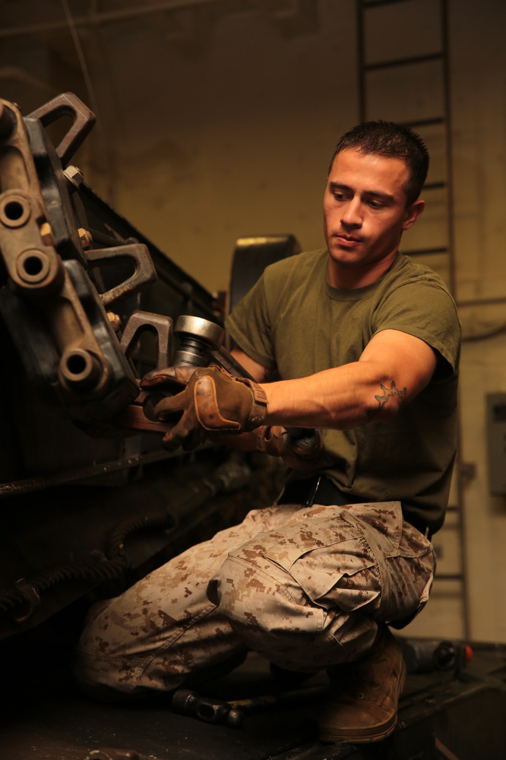 11th MEU Marines perform vehicle maintenance