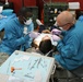 Army dental professionals provide services to a local community member