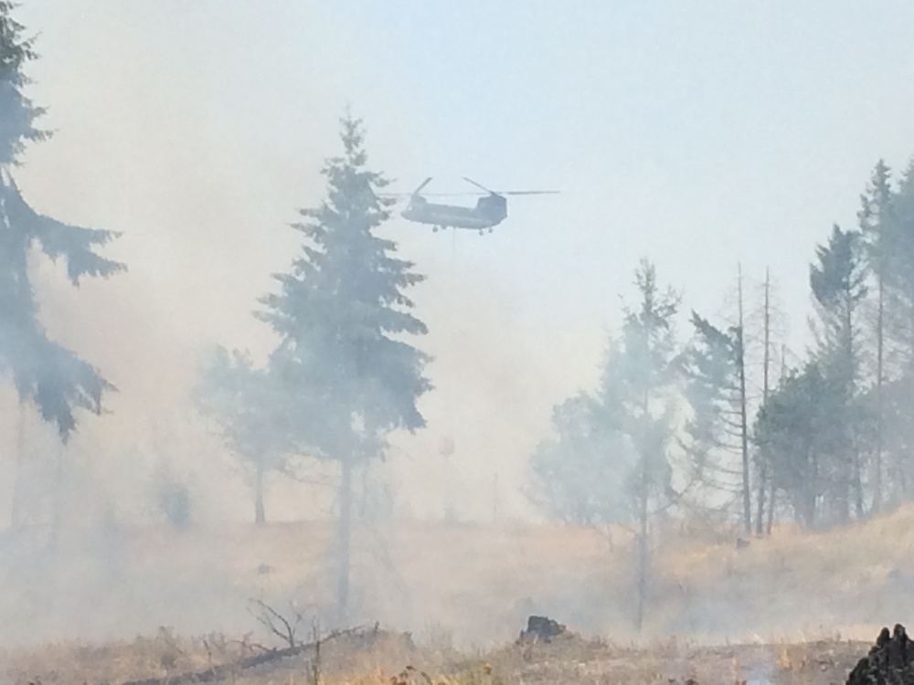 Multiple agenices work to contain JBLM wildfire