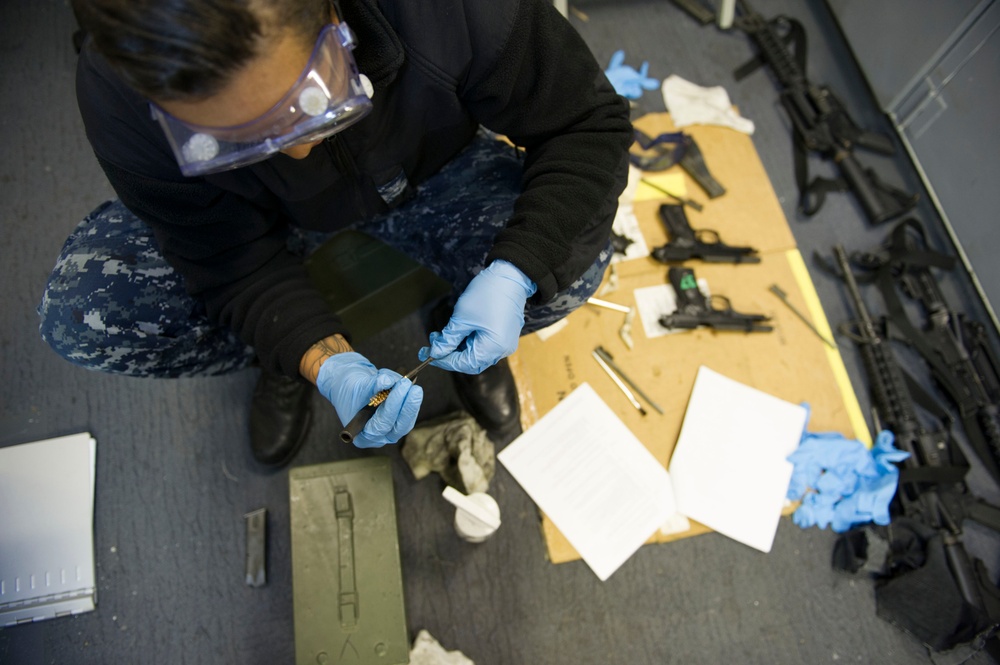 Future USS America armory sailors clean weapons